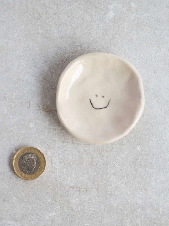 Wee Dishes. A dish with a smiley design.
