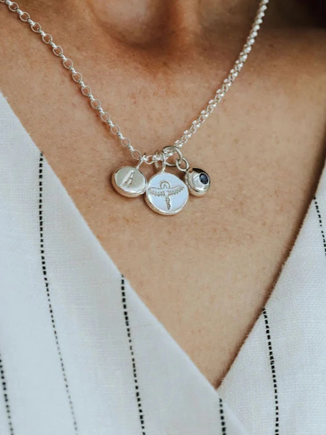 Sterling silver Phoenix Pebble Necklace with both a birthstone and a letter charm