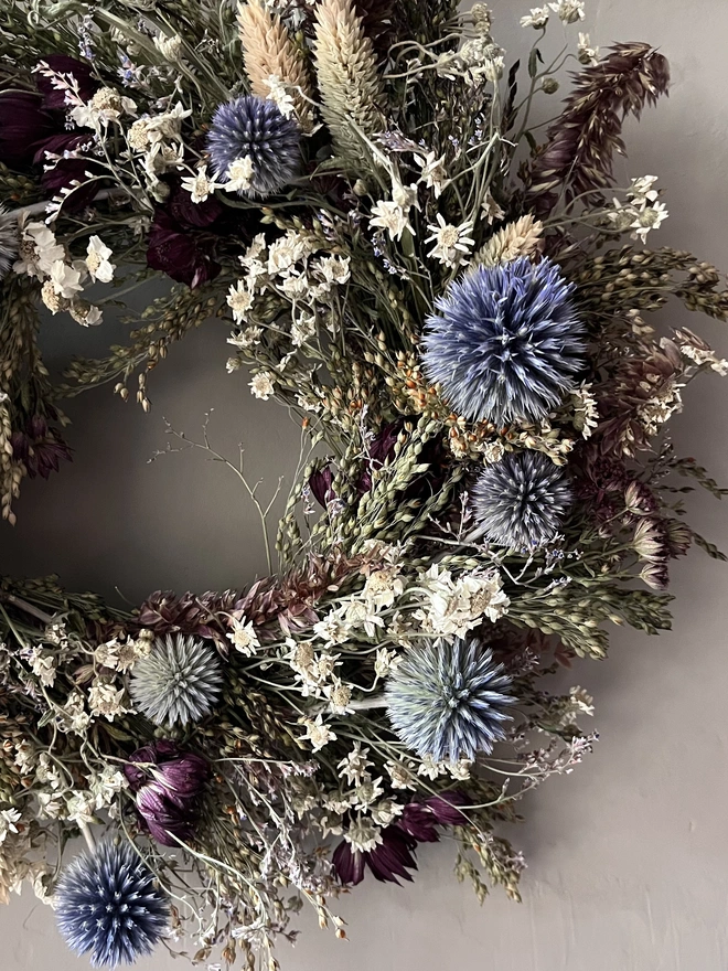 Dried Flower Winter Wreath hanging on kitchen wall 