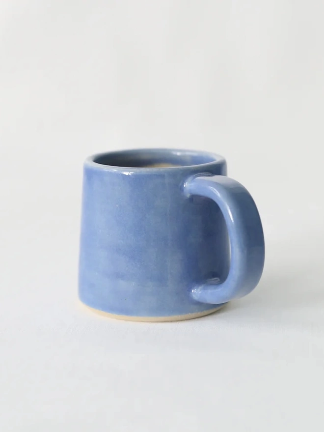 Classic Ceramic Espresso Mug, a colourful ceramic espresso mug sitting on a plain surface against a white backdrop. 
