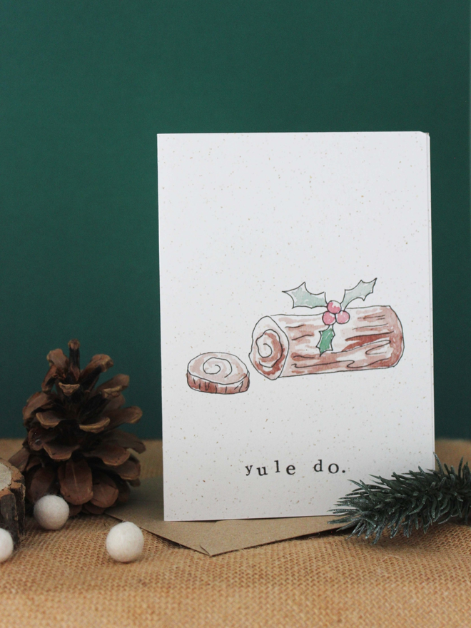 'Yule Do' Card on shelf