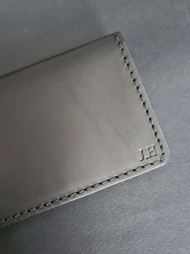blind embossed personalised sustainable leather card wallet lined with a rare silk escape map by Natthakur