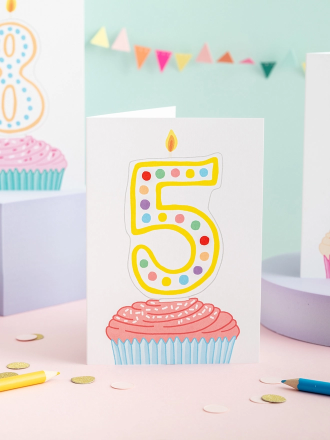 A sweet fifth birthday card featuring a cupcake and candles