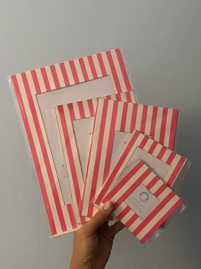 Thin Striped Screen Printed A6 / A5 / A4 Photo Mount. pink striped mounts in various sizes shown against grey background.