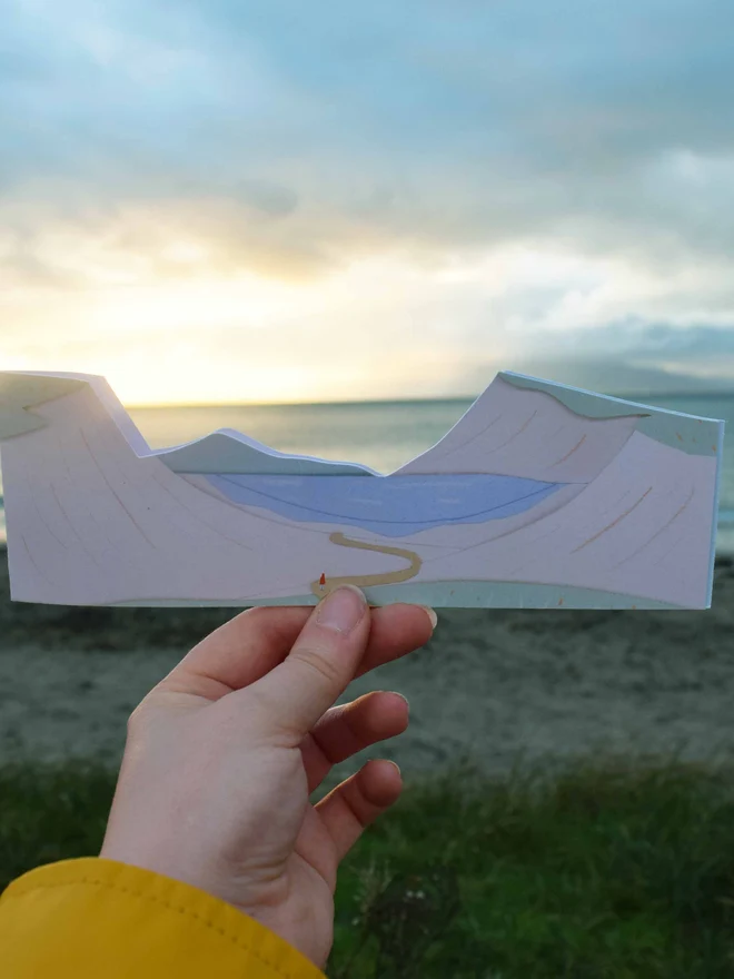 Cut out card of dunes with a sandy beach in the background