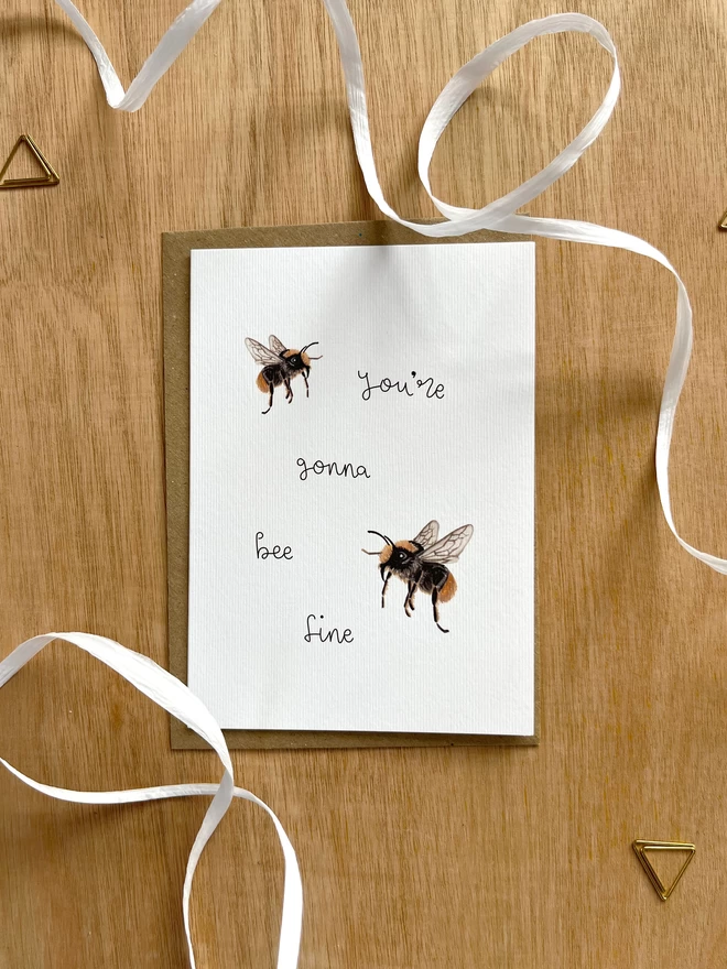 a greetings card featuring a couple of illustrated bees with the phrase “you’re gonna bee fine”