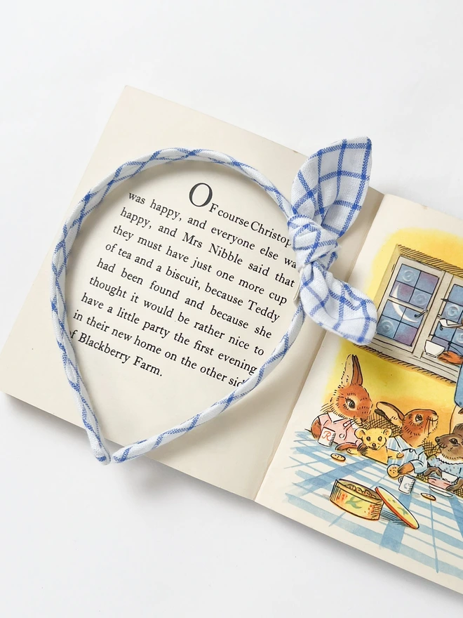 Blue Check Alice Band For Girls On A Vintage Book