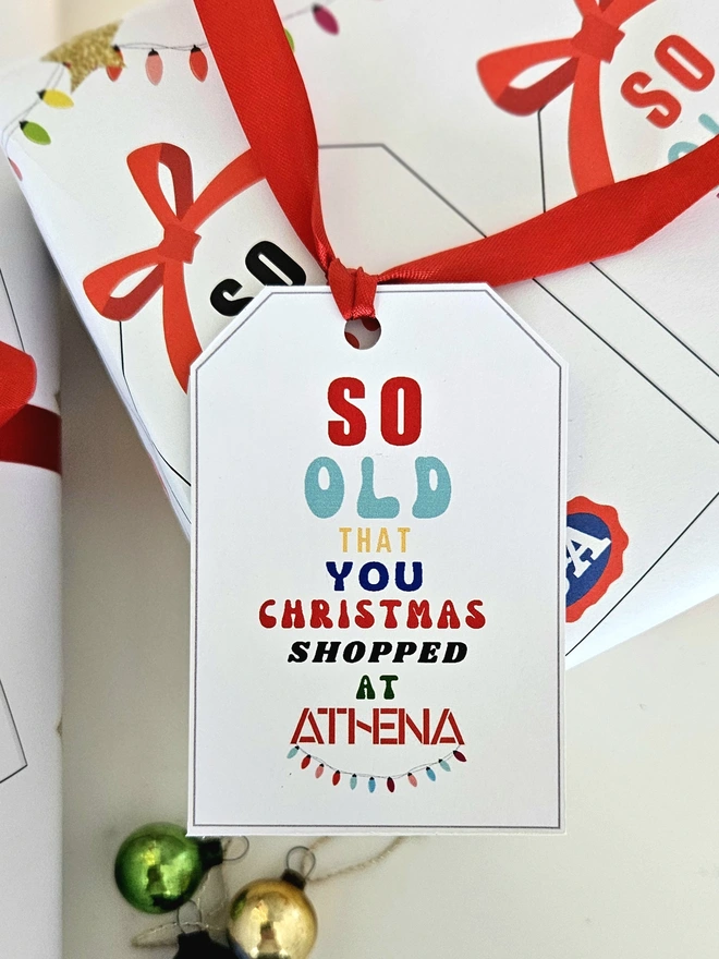 A gift tag on the present thats says so old that you Christmas shopped at Athena to match the paper.