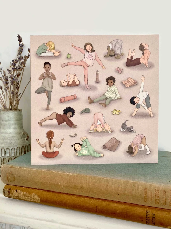 a greeting card featuring a vintage story book style illustration of lots of children doing yoga shown stood on a mantle piece