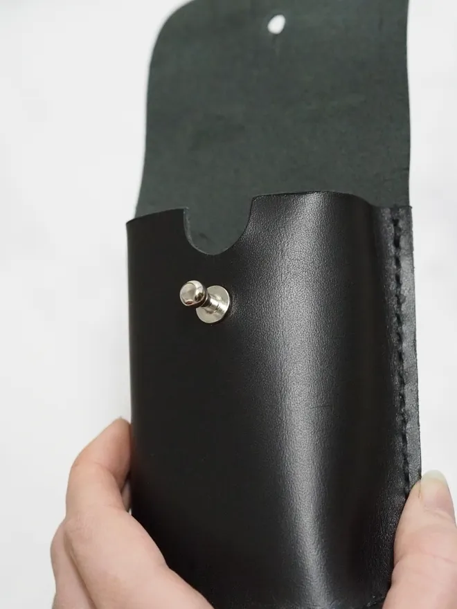 black playing card holder with large stud