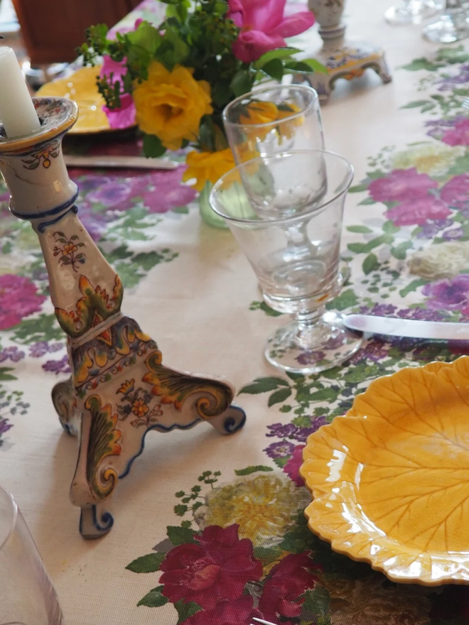 Isabel’s Roses. A tablecloth patterned with vibrant pink and red roses and anemones.