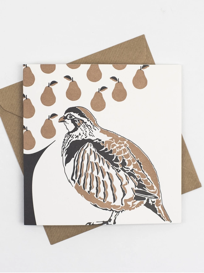 Partridge in a pear tree front of the card. Printed in metallic ink