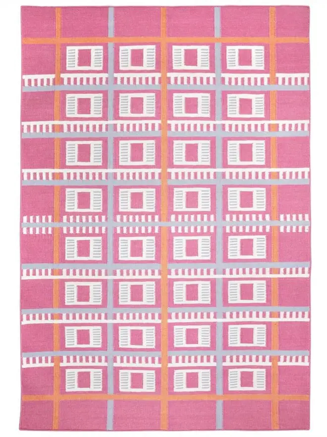 Labourdonnais Flatweave Rug, a colourful rug sitting on a plain surface. 