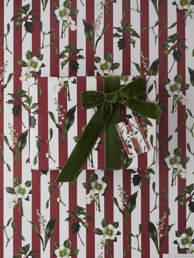 red and ivory stripe pattern with festive botanicals wrapping paper