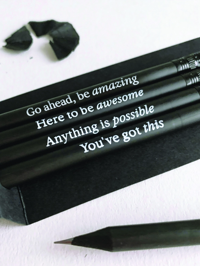 Close of of the four quotes printed onto pencils 