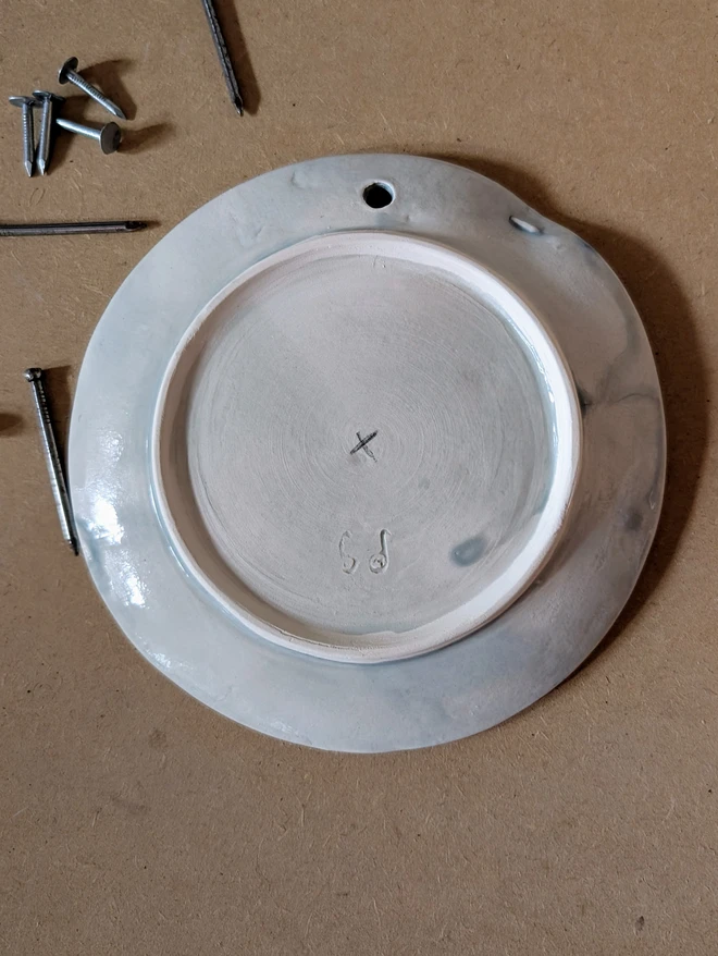 Nailed it plate with ceramic nail and grey translucent glaze back view 