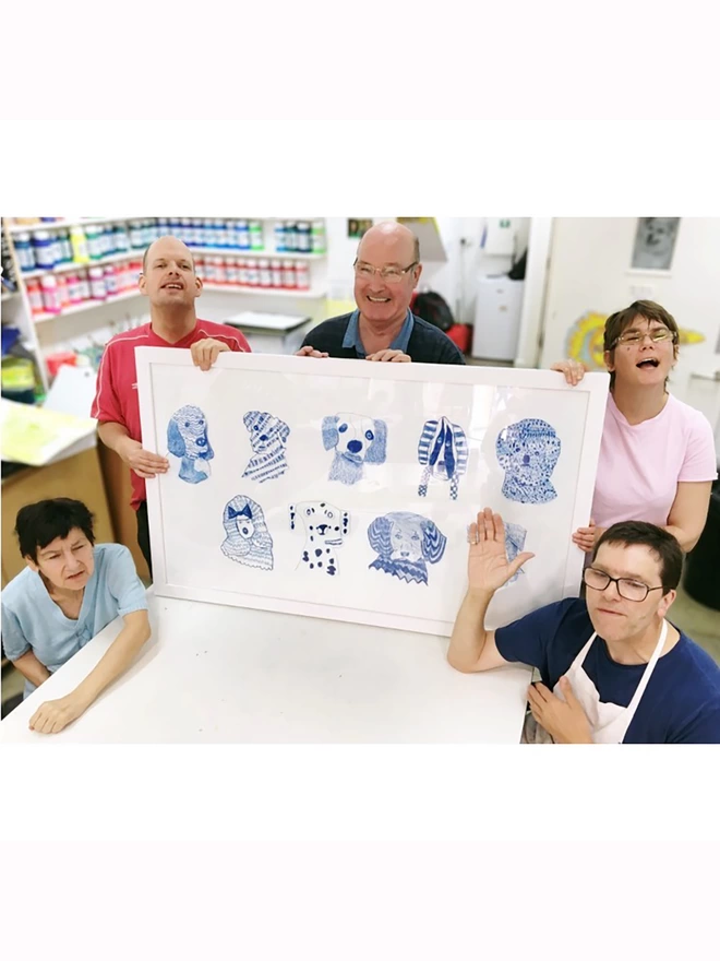 5 happy artist holding original artwork for blue dogs 100% organic cotton charity tea towel