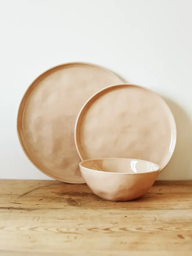stoneware place setting dining set. a pink plate and bowl dining set.