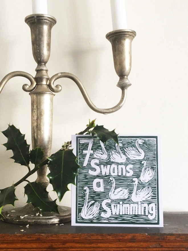 Christmas card Seven Swan a Swimming The Twelve Days of Christmas linocut design by Kate Guy
