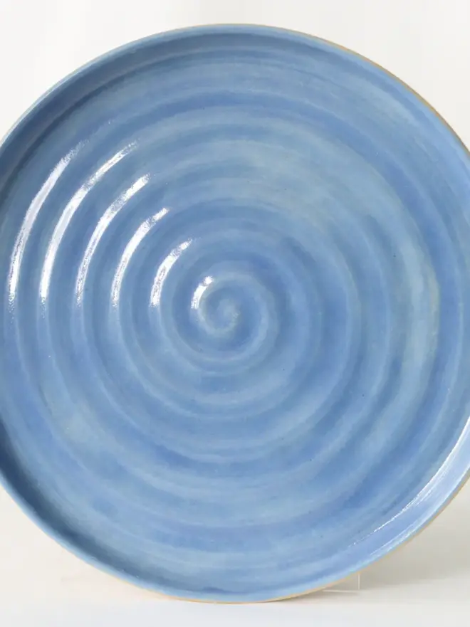 blue ceramic plate with textured swirl design