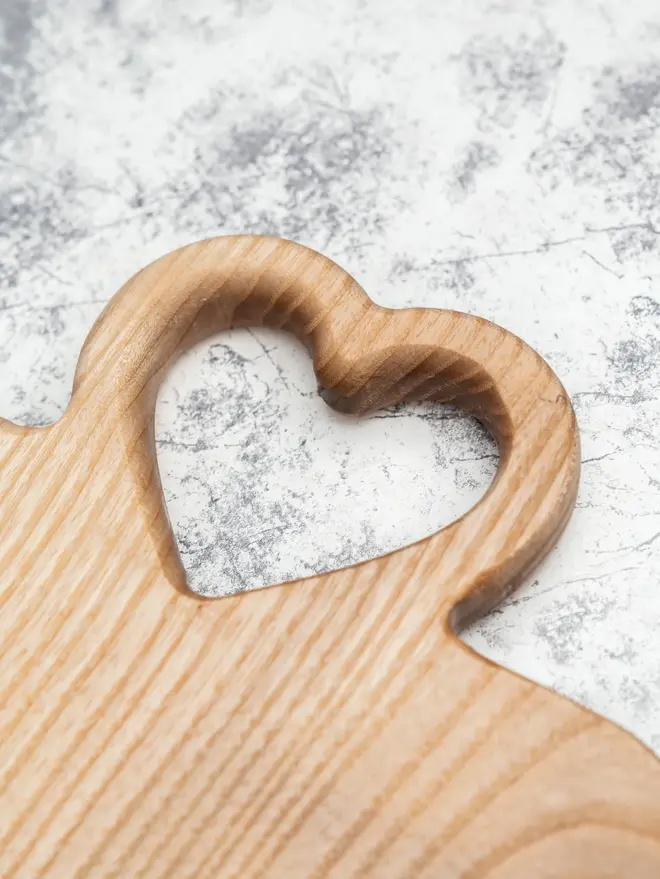 Medium Serving Board, on a marble surface. 