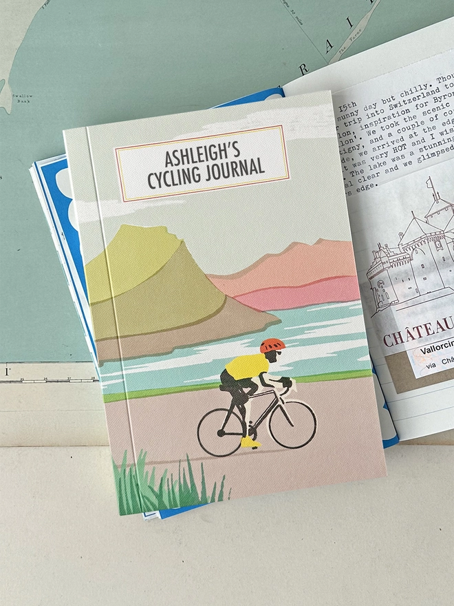 Cycling travel journal lifestyle shot on open book