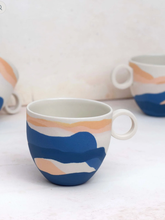 Shore Dreamlands Espresso Cup. A selection of cups from the Shore Dreamlands collection, showing typical variation in decoration.