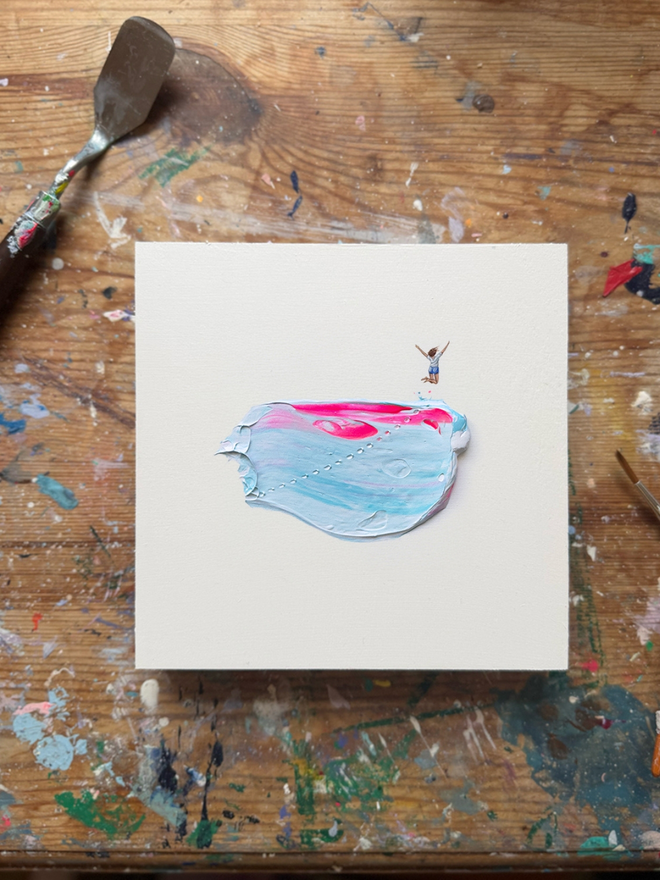 'I Did It!' Art Splat Piece. Textured artwork of girl jumping for joy on pink and purple paint.