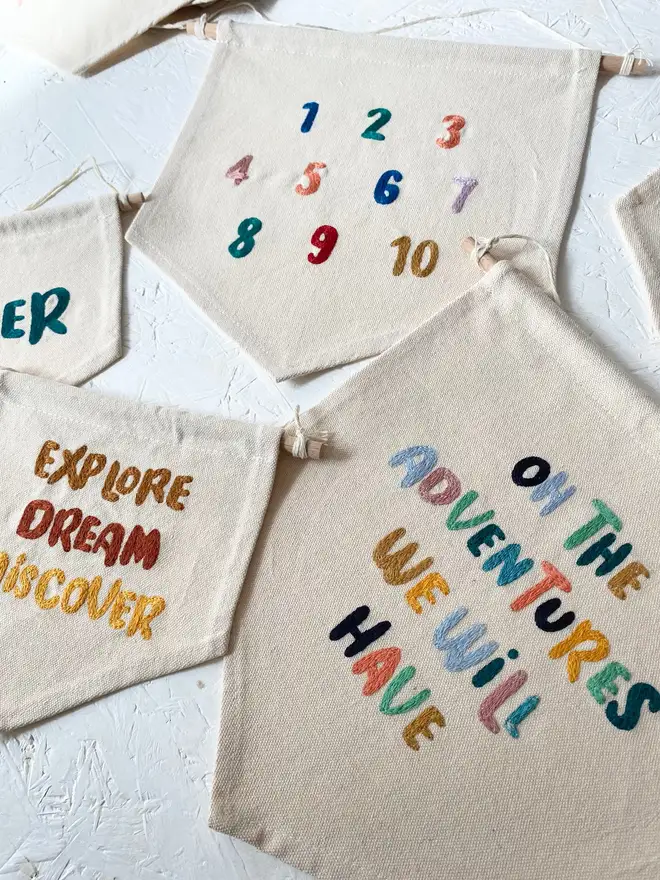 custom embroidered phrase banner. cotton banner embroidered with custom phrases