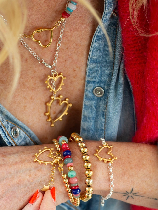 Designed for colour lovers, the Love Drunk Wrap Bracelet pairs polished metal beads with pops of jade in a flattering double wrap style. Finished with a mini studded heart and star charm, this charm bracelet is perfect for stacking, gifting or wearing solo when you need a little extra sparkle.