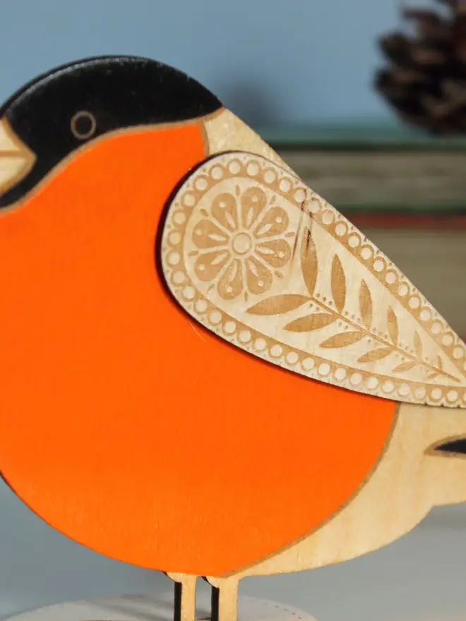 Standing Wooden BullFinch,Standing Wooden BullFinch, orange wooden bird decoration standing on a platform. 