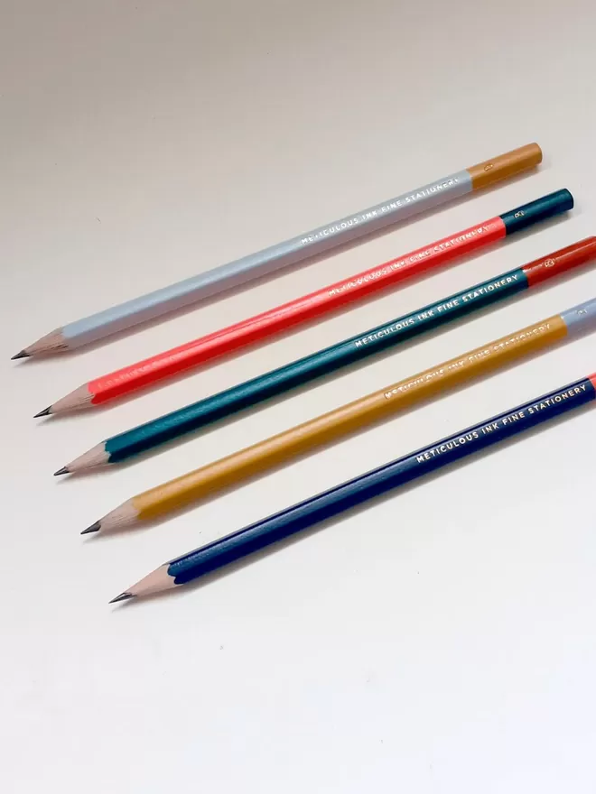 Meticulous Ink Personalised Pencils seen in different colourways lined up.