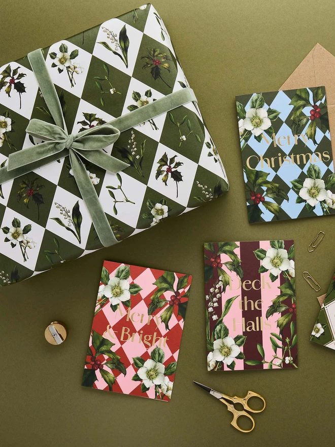 green and ivory harlequin pattern with festive botanicals wrapping paper with co-ordinating cards