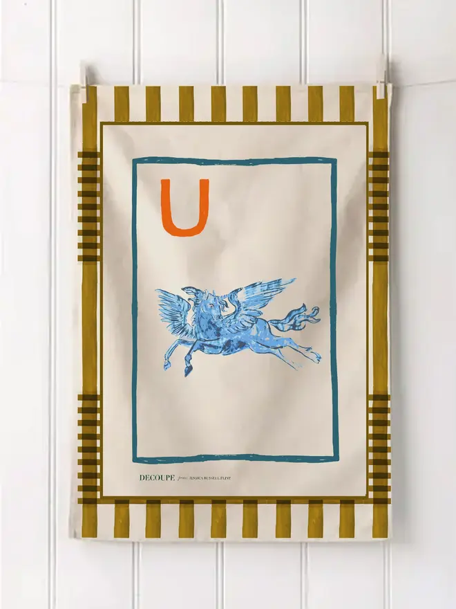 a-z alphabet tea towel. a tea towel with a unicorn print and the letter 'u' in the corner.