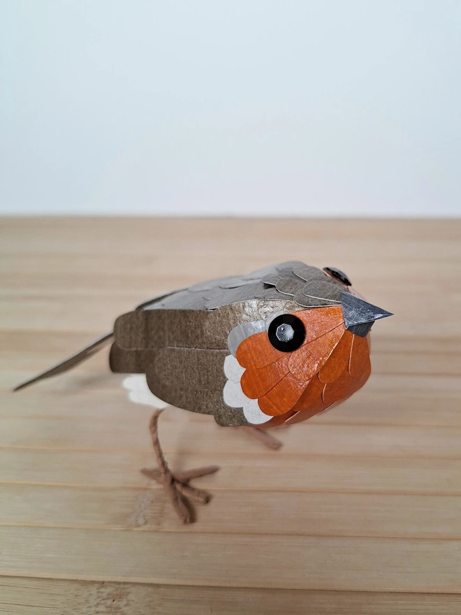 close up of the robin paper sculpture's face