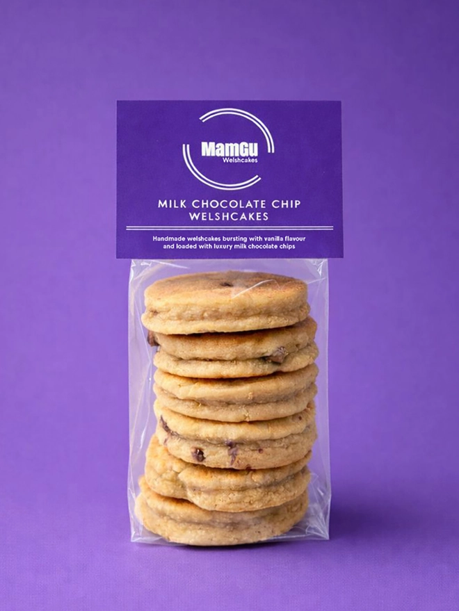 Chocolate Chip Welsh Cakes in clear packaging with a purple tag and purple studio background