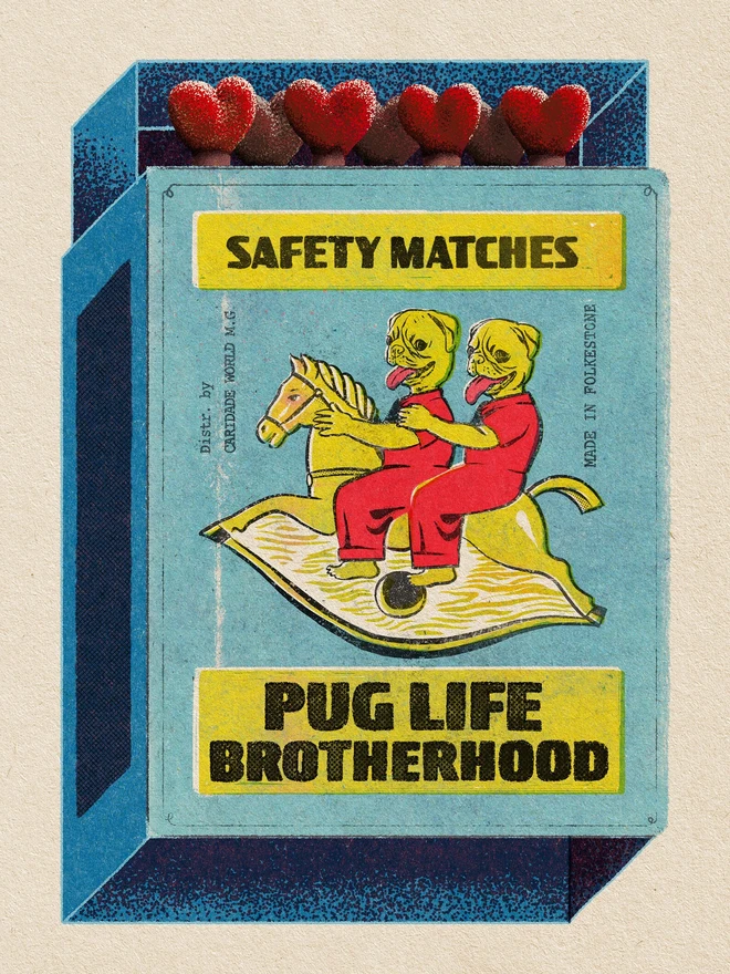 A light blue matchbox with a yellow label that reads "SAFETY MATCHES" at the top and "HAPPY BIRTHDAY" at the bottom. The matchbox is partially open, revealing five red heart-shaped match heads. The main illustration on the matchbox features two yellow, dog-like figures with red outfits and long red tongues, riding a single yellow rocking horse. Text on the side of the illustration reads "Distr. by Caridade World M.G." and "MADE IN THE U.K."