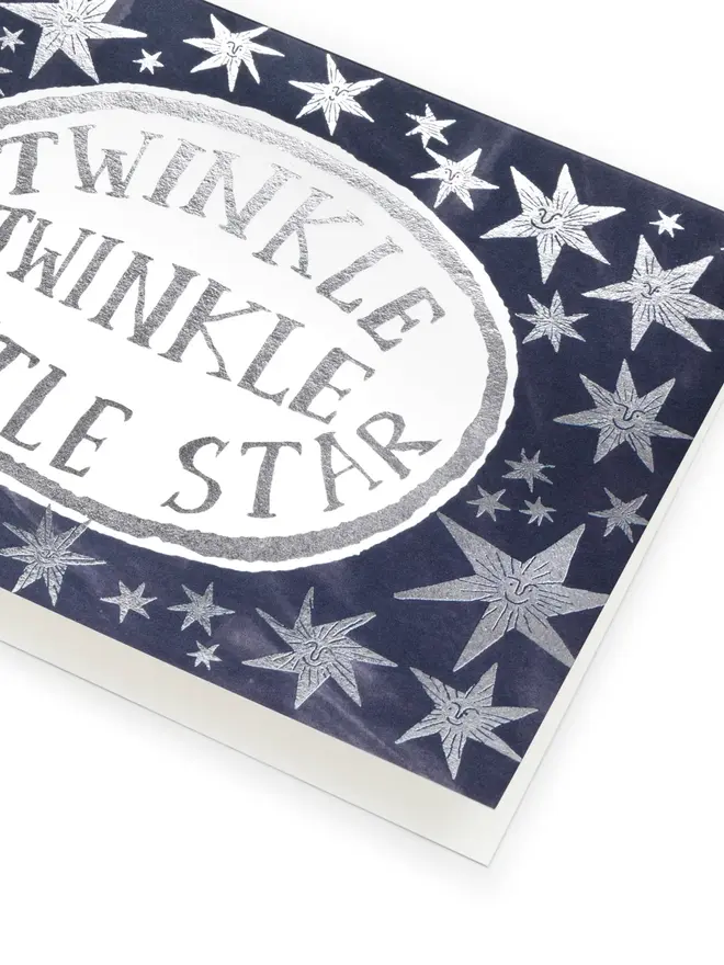 black card with silver stars
