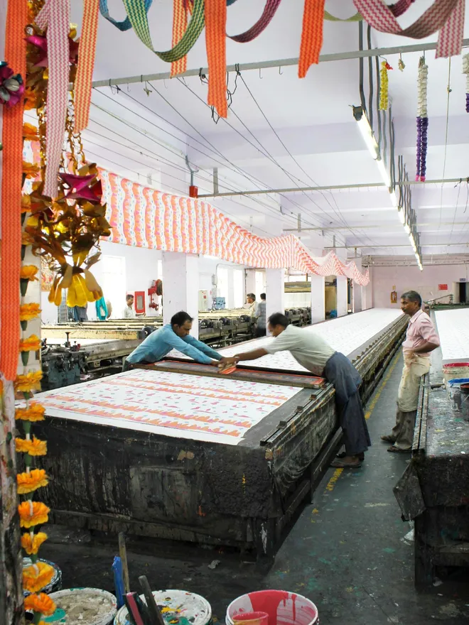 Artisans in India hand screen printing fairy chimney fabric