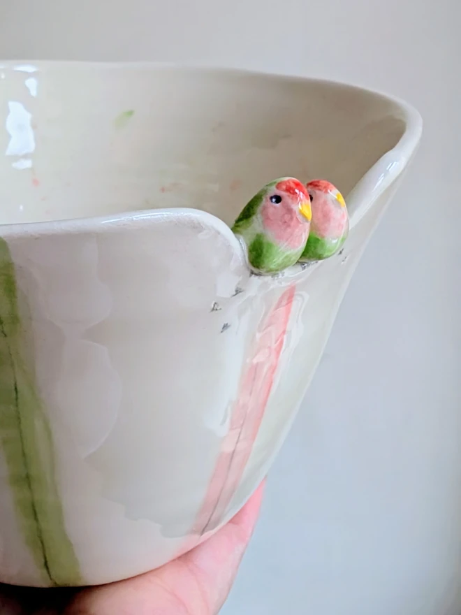 lovebird bird couple ceramic bowl or planter with pink, red and green stripes, hearts and splatters