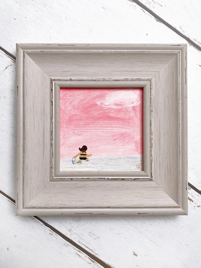 painting of sunset and swimmer in chunky pale grey frame
