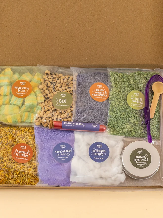 witches and wizards themed childrens potion kit. nine bags of different sensory materials packed into bags and placed into a cardboard box.