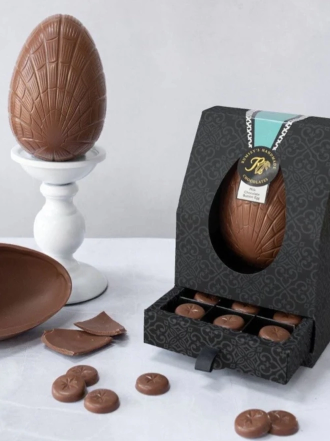 Milk chocolate button egg, displayed egg