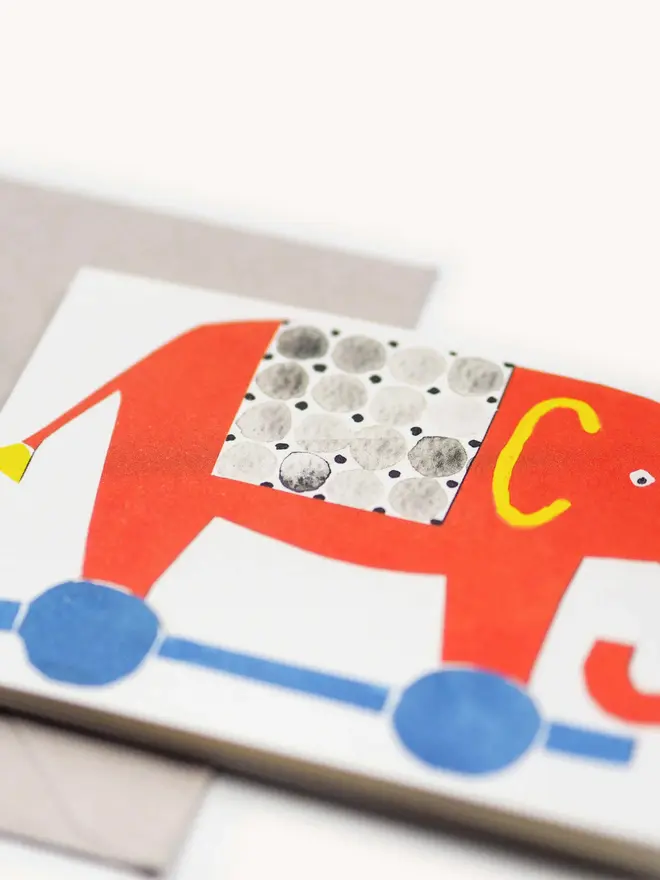 brightly coloured card with elephants