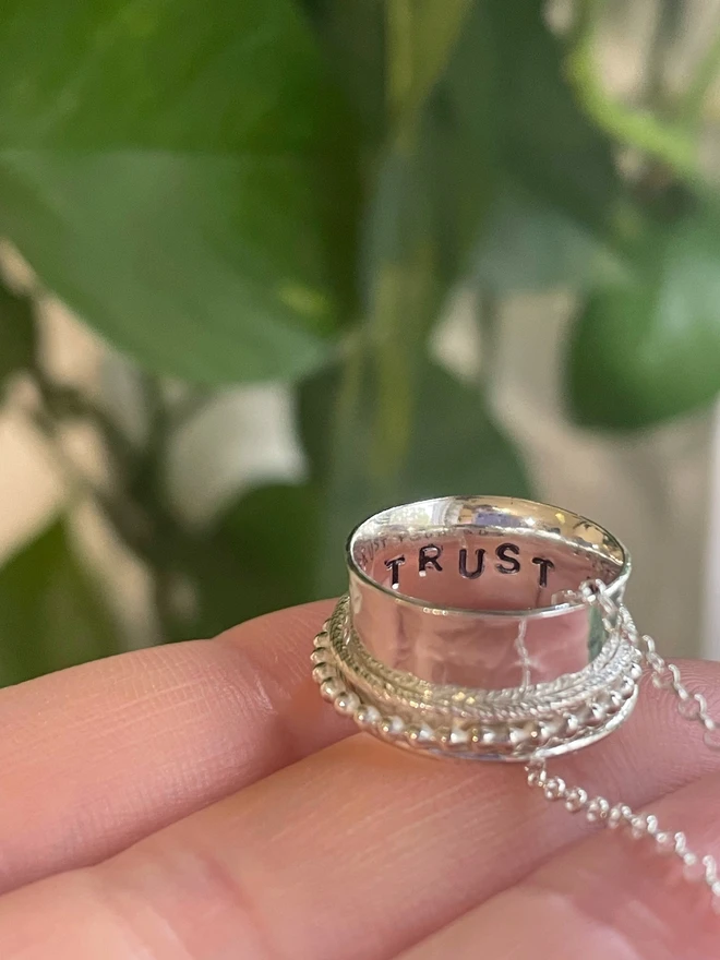 The 'Trust Your Gut' Spinner Pendant Necklace, gives you the reminder you need when the going gets tough. An adult fidget spinner to give you something tactile to do with your hands. This piece of jewellery is hand made from recycled sterling silver from a small business in the UK.