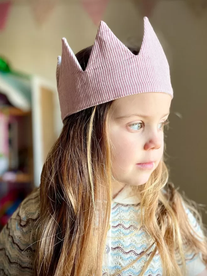 Girl wearing the Circus Stripe Crown