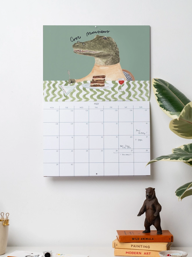 Wall calendar January 2027 with an illustrated crocodile and plant