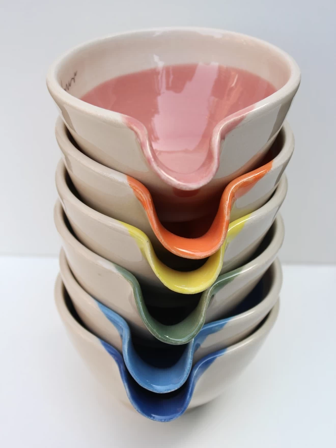 stack of mini handmade ceramic bowls in rainbow colours