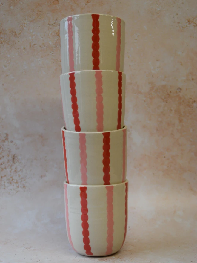 Handmade ceramic Stripe Pop tumblers — stacked red striped pair