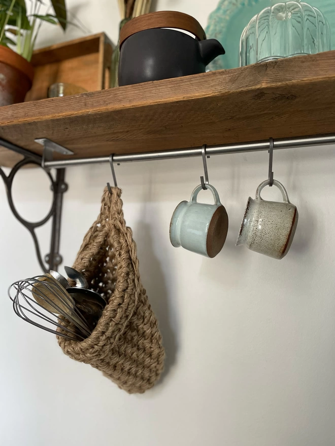 large brown jute hanging storage baskets, handmade sustainable crochet decor, rustic natural organic homeware accessories, brown strong jute storage solution, kitchen bathroom bedroom hanging storage basket